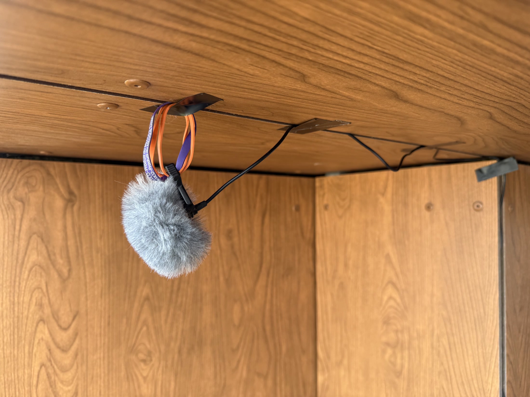 The microphone mounted under the balcony ceiling.